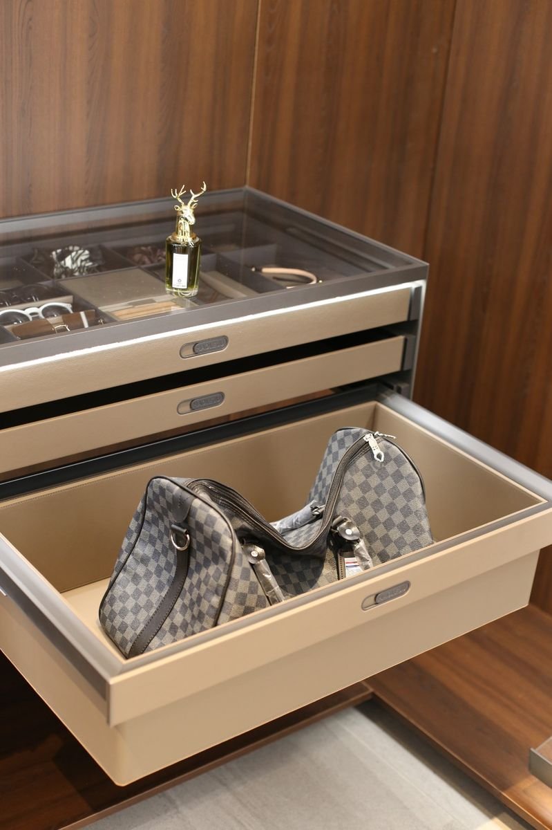 Fendi Series — Leather-lined wardrobe drawer holding a travel bag