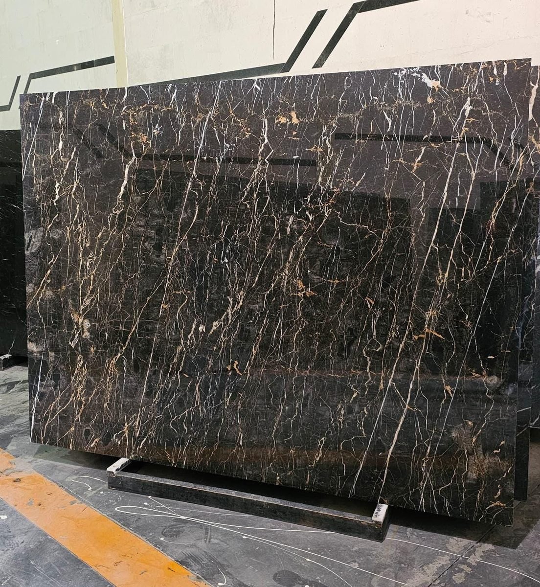 Marble Collection — Black marble slab with gold and white veining