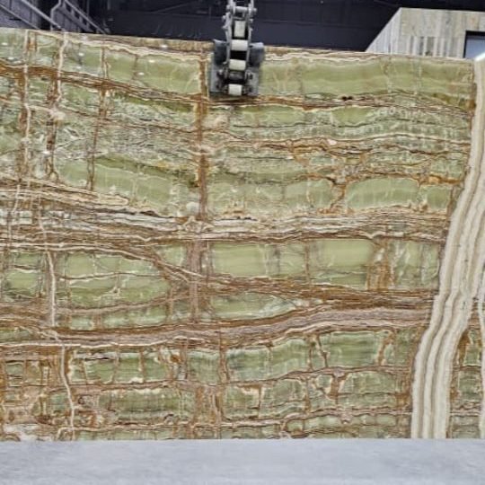 Marble Collection — Green onyx slab with fine amber veining