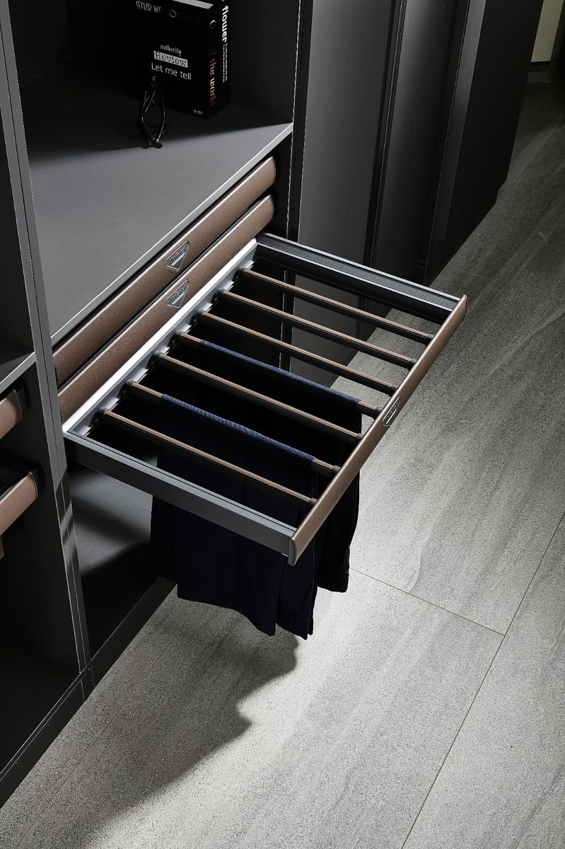 Musi Series — Pull-out trouser rack in a dark wardrobe